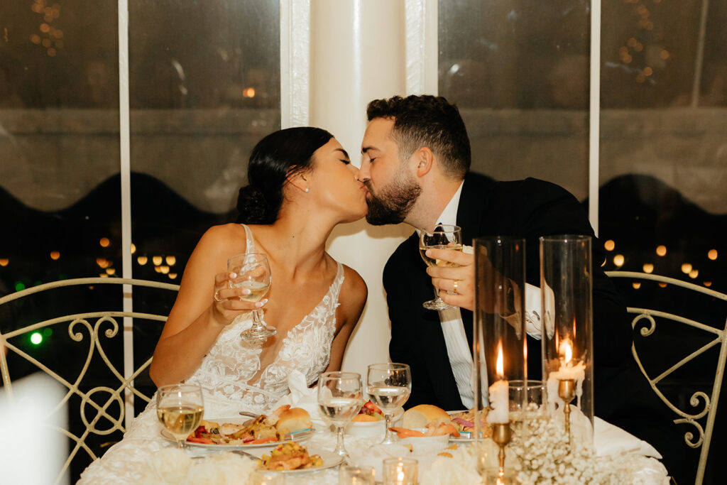 Bride and groom at sweetheart reception table