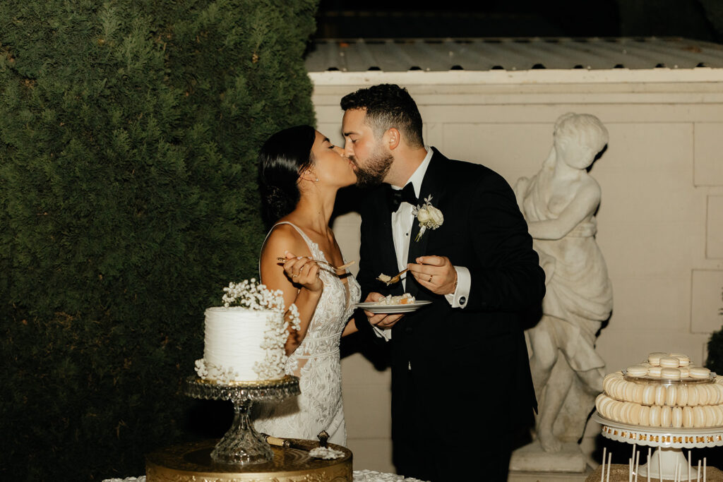Bride and groom cutting cake