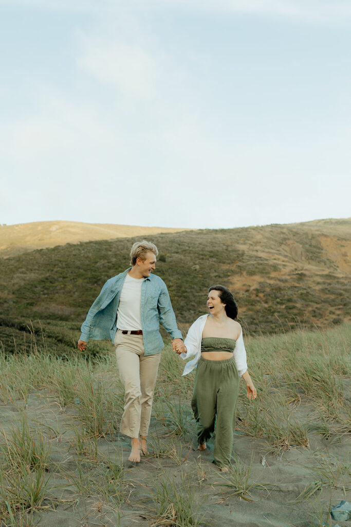 Couple walking in an open field