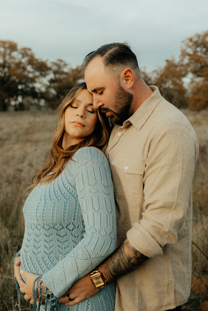Man and woman posing for photos