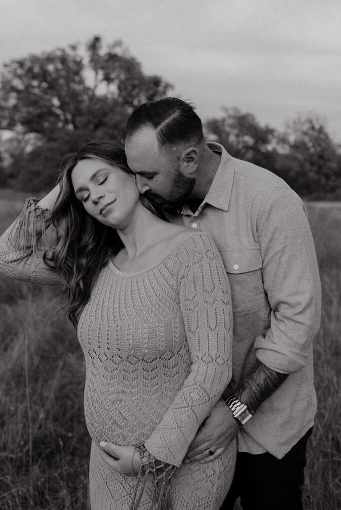 Couples romantic Sacramento maternity photos in an open field