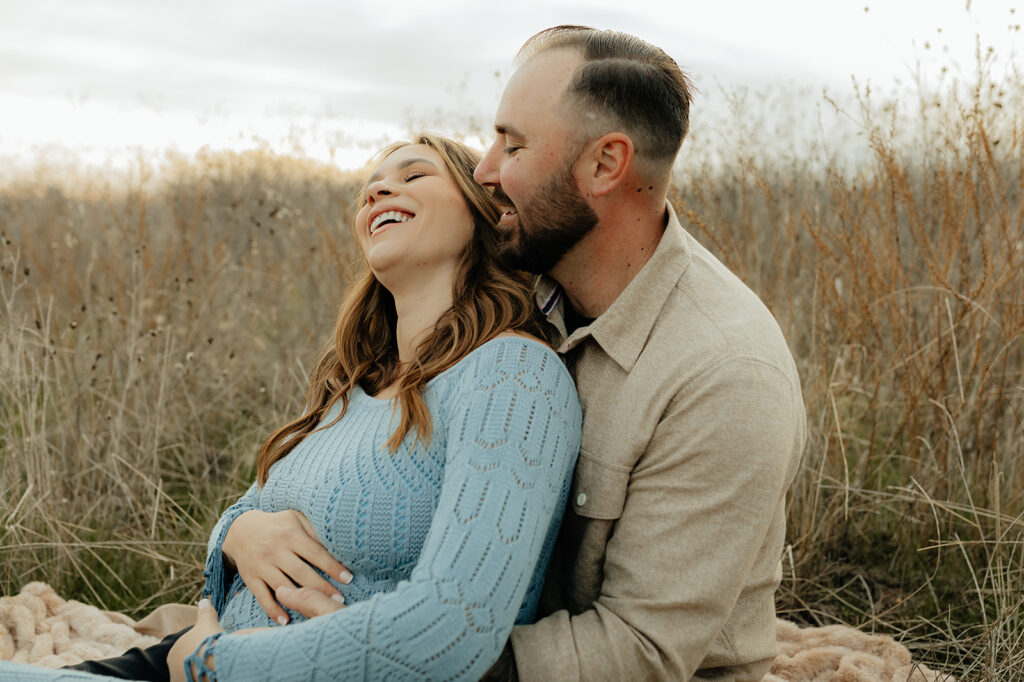 Couples romantic Sacramento maternity photos in an open field