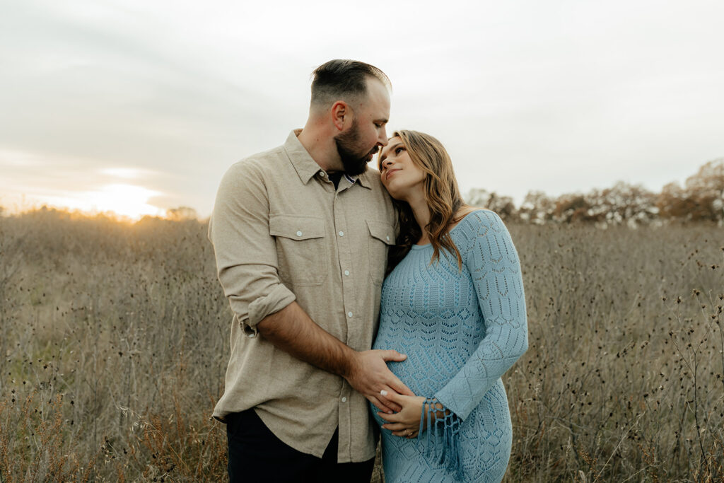 Couples romantic Sacramento maternity photos in an open field
