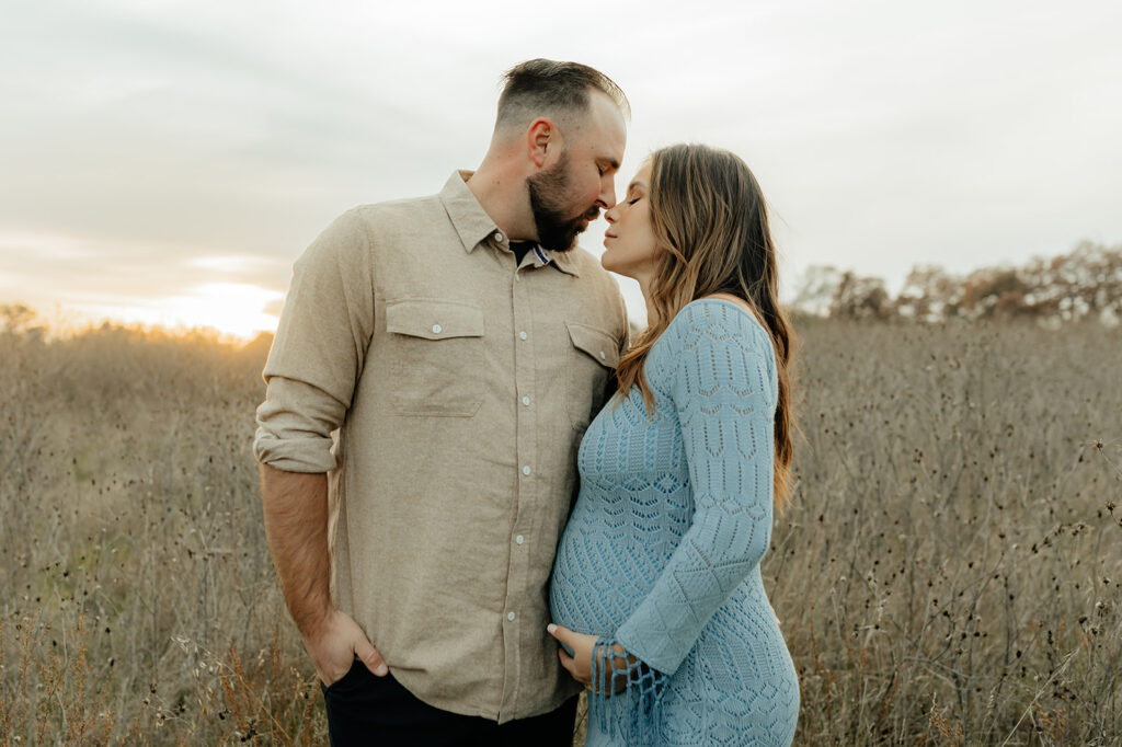 Couples romantic Sacramento maternity photos in an open field