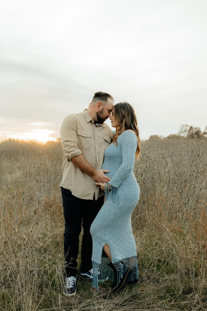 Couples romantic Sacramento maternity photos in an open field