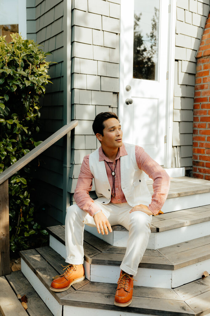 Groom sitting on steps