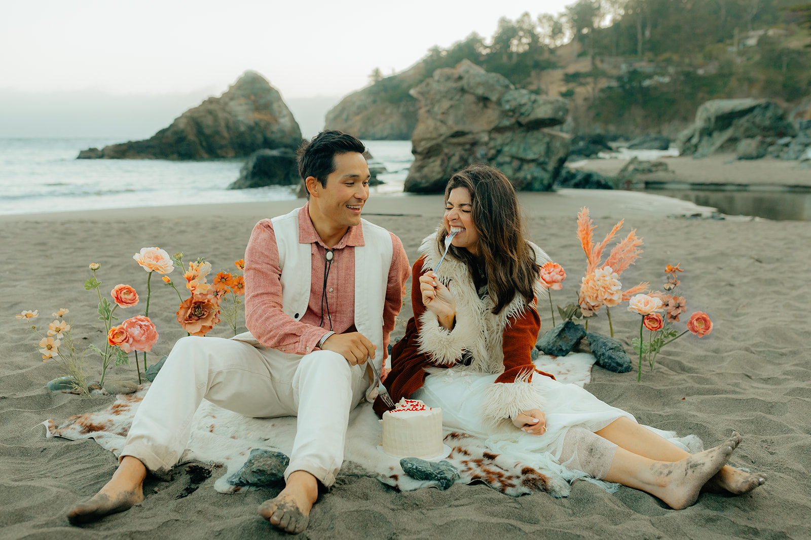 Western inspired bride and groom eating cake during their Muir Beach elopement