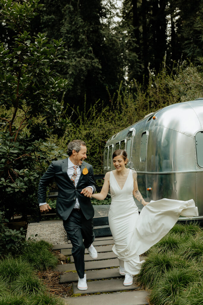 couple running holding hands 