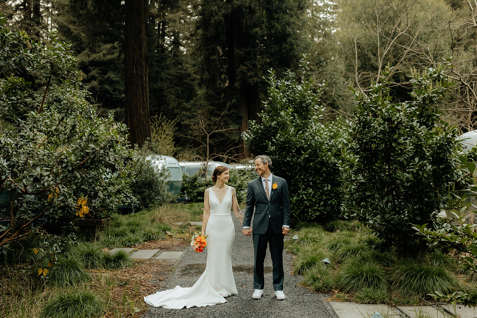 newly married couple looking at each other at their intimate outdoor wedding day