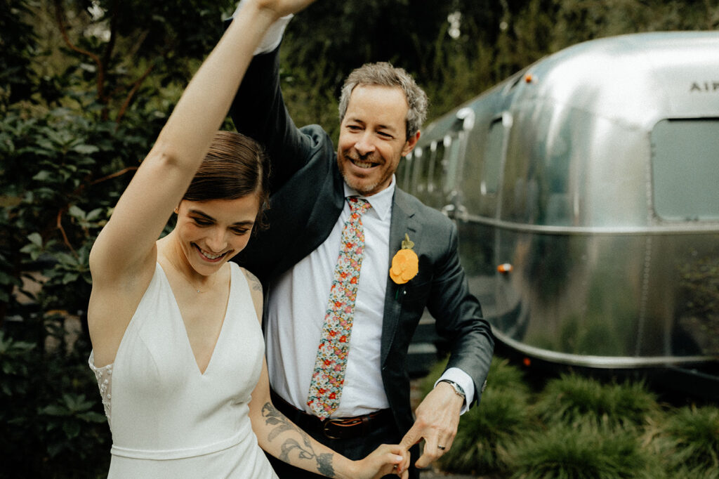 cute couple dancing at their intimate outdoor wedding 