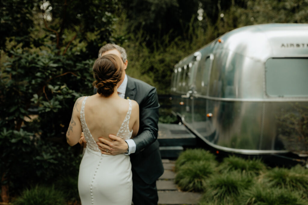 bride and groom hugging 