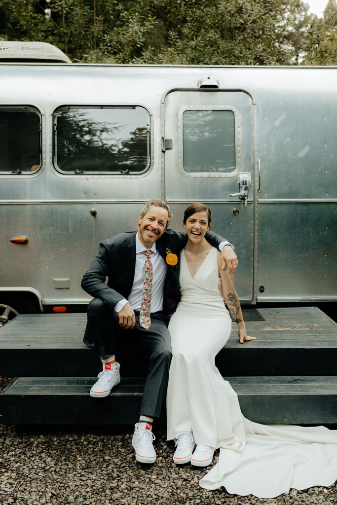 bride and groom looking at the camera 