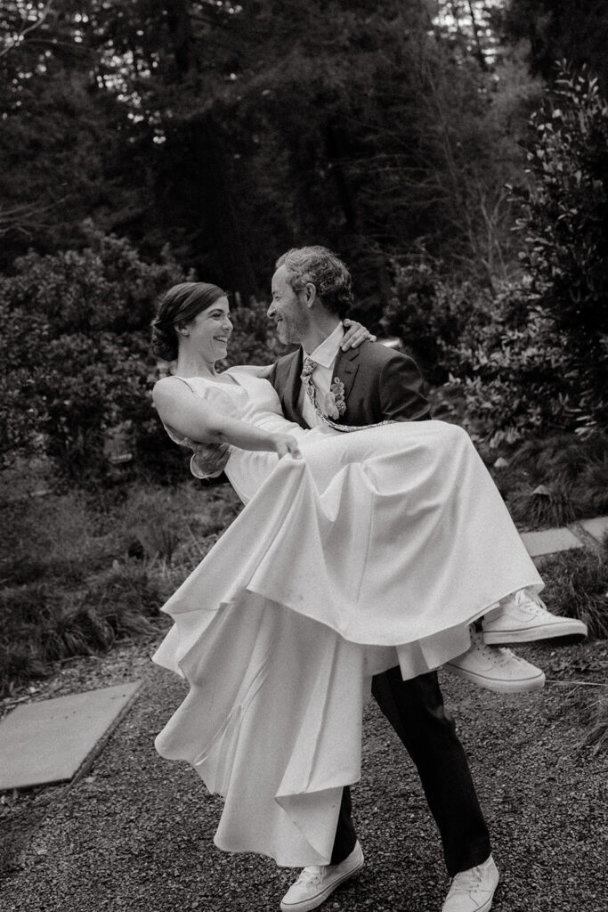 groom carrying the bride 