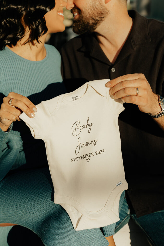 happy couple during their baby announcement photoshoot 