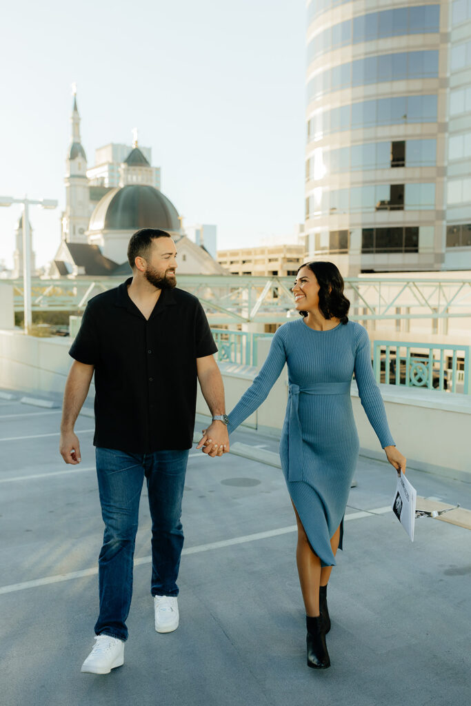 couple walking holding hands 
