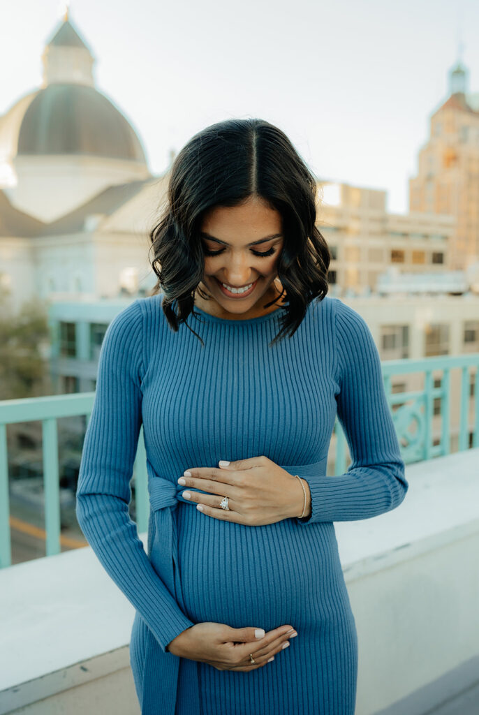 happy mom to be at her baby announcement session