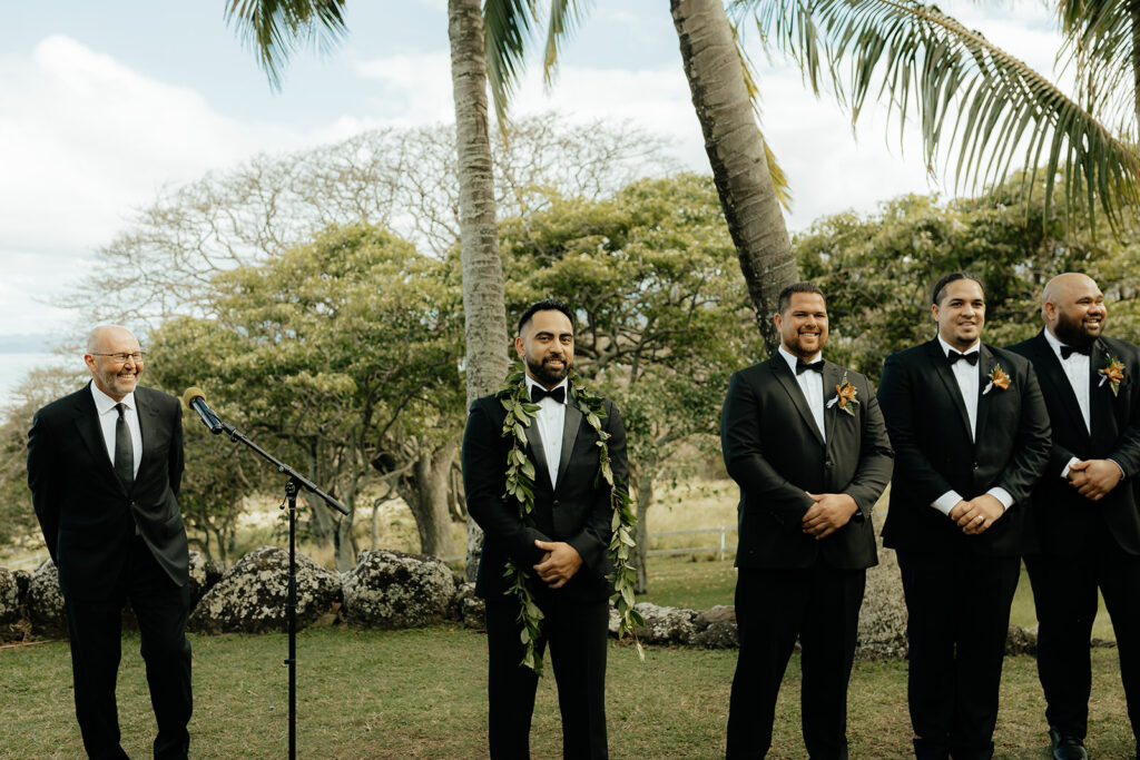 groom waiting for the bride at the altar