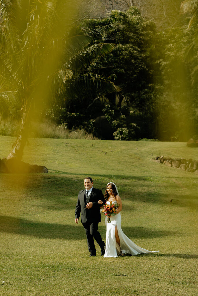 bride and her dad walking down the aisle
