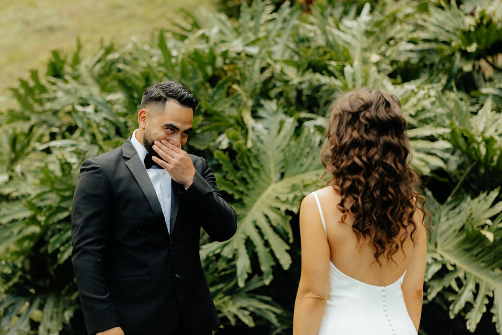 groom emotional seeing the bride in her wedding dress 