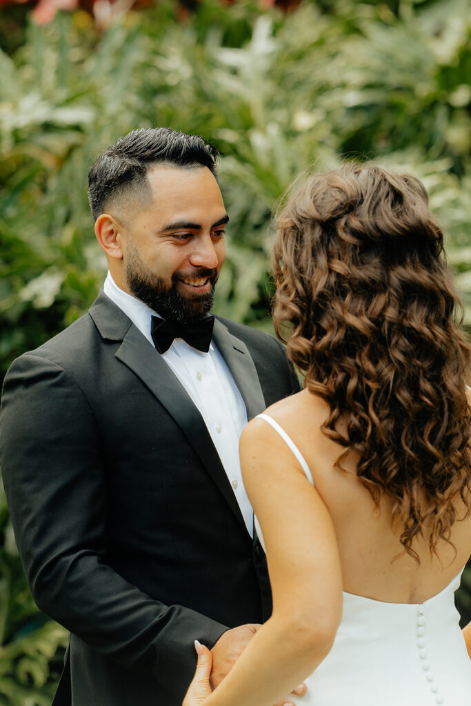 bride and groom looking at each other 