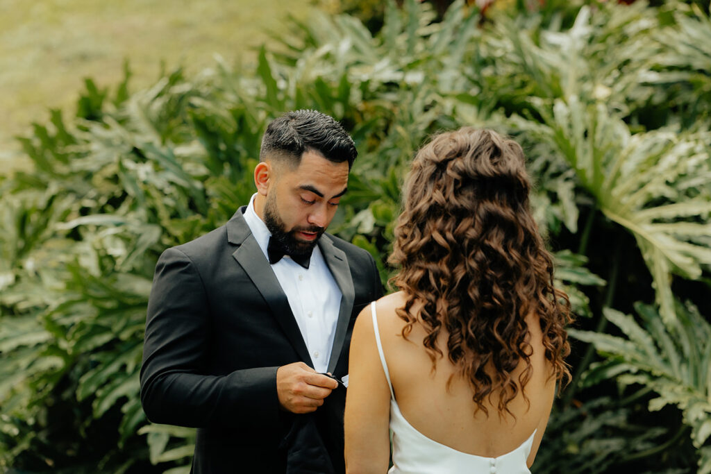 bride and groom reading their vows