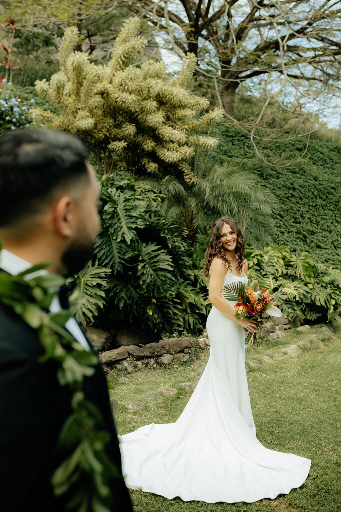 groom looking at the bride