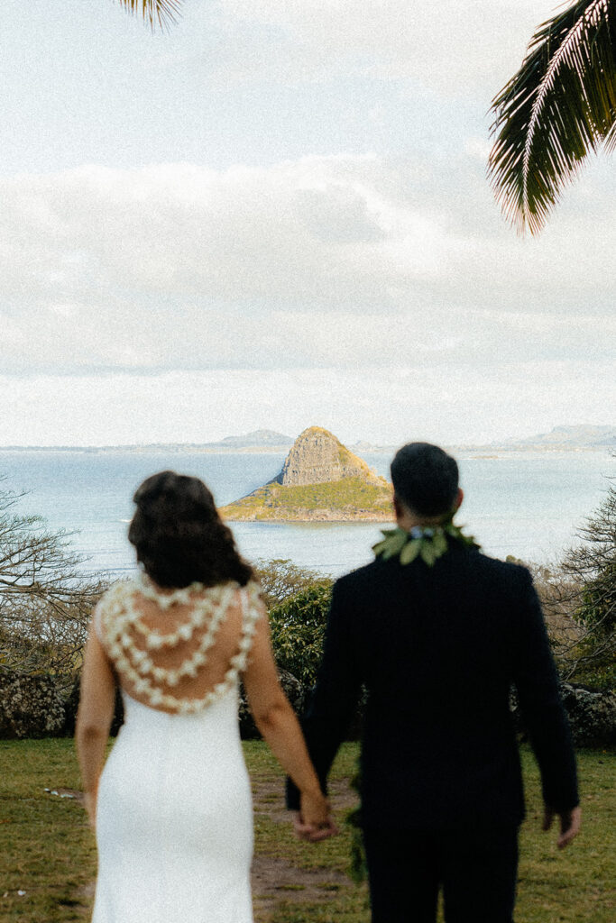 bride and groom holding hands