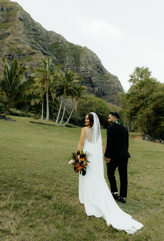 bride and groom walking around their wedding venue 