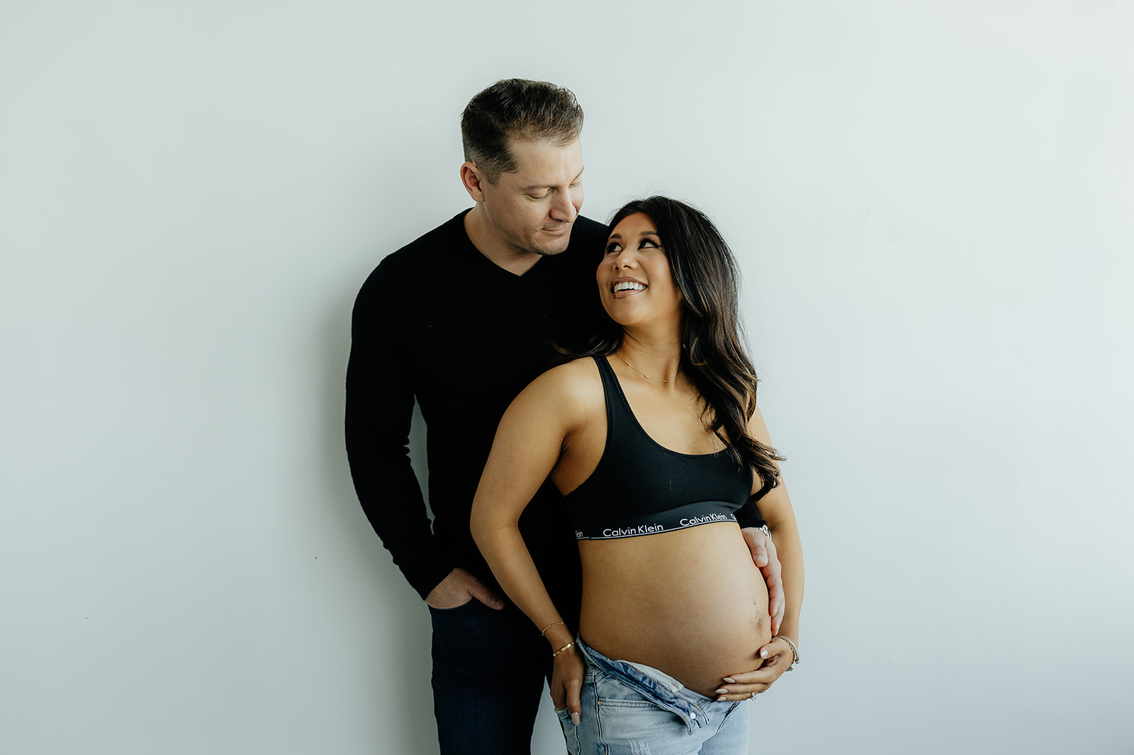 happy couple looking at each other during their photoshoot
