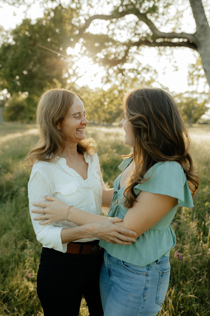 mom an daughter smiling to each other 
