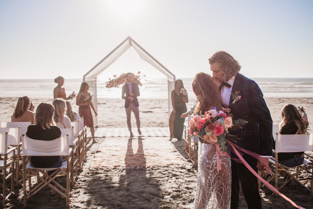 Rachel Christopherson San Luis Obispo Boho Beach Elopement Wedding Bride and Groom recessional kiss