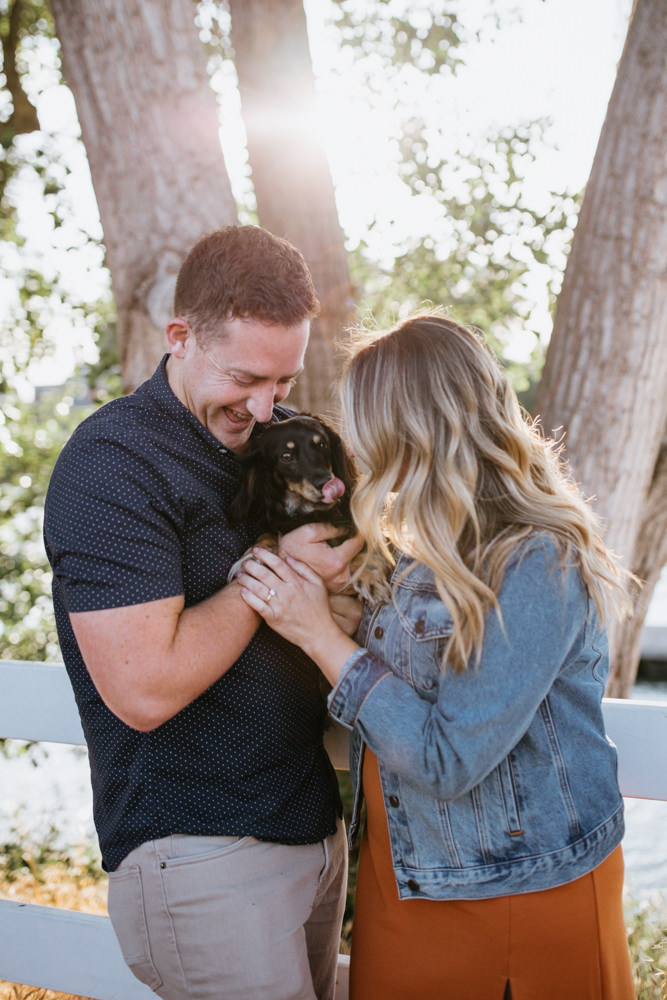 Sacramento River Engagement Session Northern California Weiner dog engagement shoot outfit inspo engagement photos with dog couples shoot posing golden hour sacramento river rachel christopherson photography dog kiss