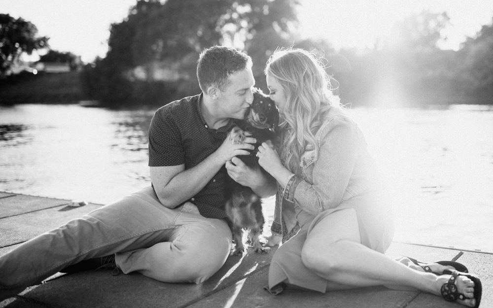 Sacramento River Engagement Session Northern California Weiner dog engagement shoot outfit inspo engagement photos with dog couples shoot posing golden hour sacramento river rachel christopherson photography black and white on dock