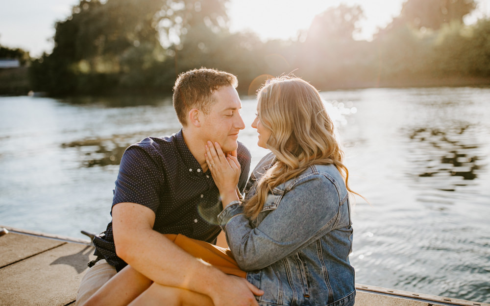 Sacramento River Engagement Session Northern California Weiner dog engagement shoot outfit inspo engagement photos with dog couples shoot posing golden hour sacramento river rachel christopherson photography on boat dock 