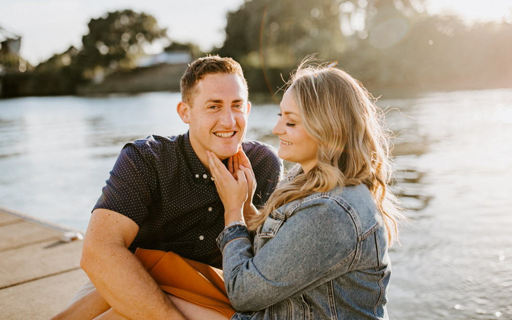 Sacramento River Engagement Session Northern California Weiner dog engagement shoot outfit inspo engagement photos with dog couples shoot posing golden hour sacramento river rachel christopherson photography boat dock on river
