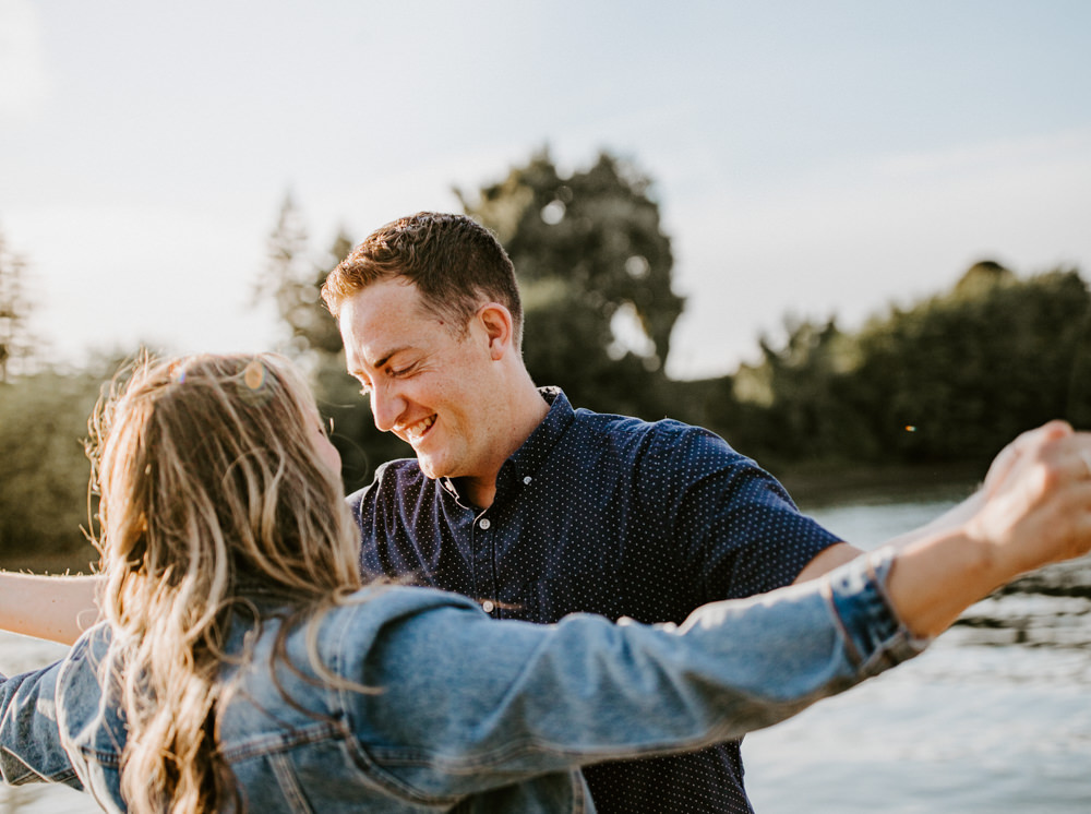 Sacramento River Engagement Session Northern California Weiner dog engagement shoot outfit inspo engagement photos with dog couples shoot posing golden hour sacramento river rachel christopherson photography titanic pose