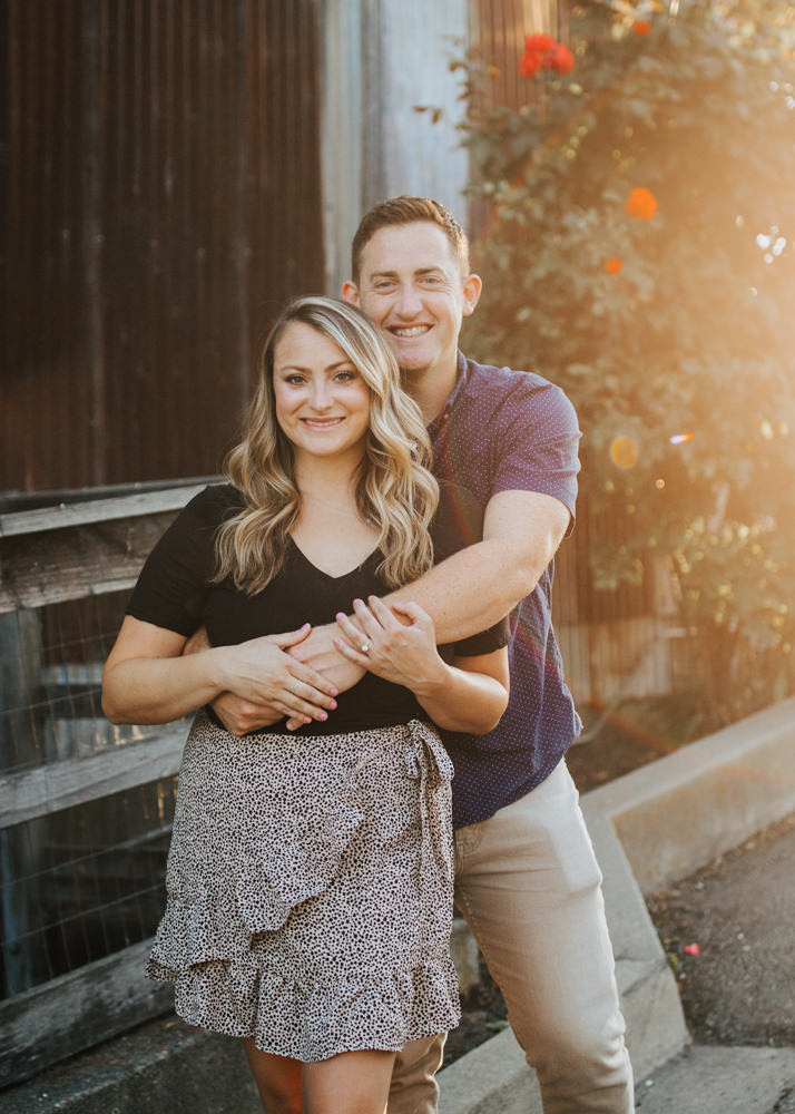 Sacramento River Engagement Session Northern California Weiner dog engagement shoot outfit inspo engagement photos with dog couples shoot posing golden hour sacramento river rachel christopherson photography classic smile 
