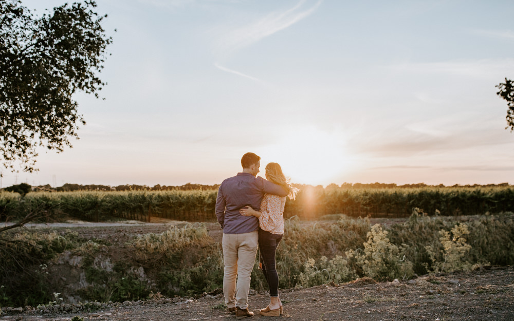 Sacramento River Engagement Session Northern California Weiner dog engagement shoot outfit inspo engagement photos with dog couples shoot posing golden hour sacramento river rachel christopherson photography golden field sunset