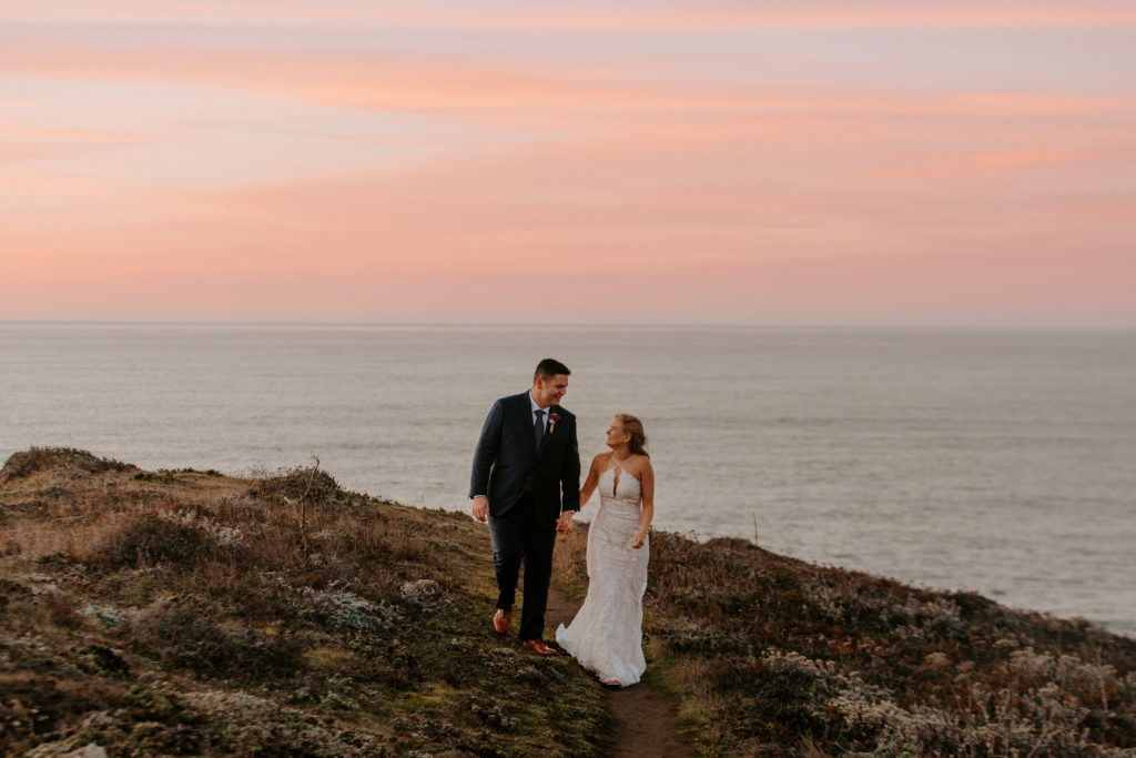 bride and groom walking during sunset at beach, Mendocino elopement, mendocino wedding, christmas elopement, best places to elope in california, norcal elopement, northern california elopement, elopement inspo, california coast elopement, mendocino california elopement, Rachel Christopherson Photography 