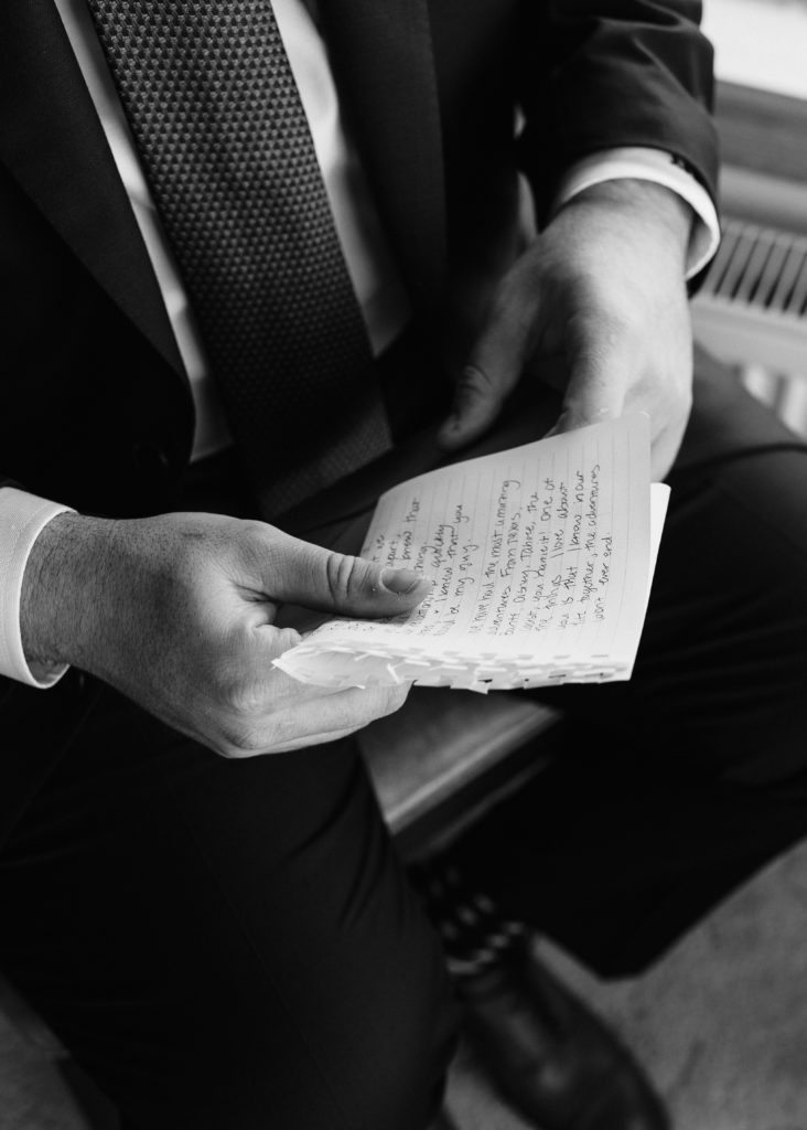 black and white groom reading wedding letter, christmas elopement, best places to elope in california, norcal elopement, northern california elopement, elopement inspo, california coast elopement, Rachel Christopherson Photography