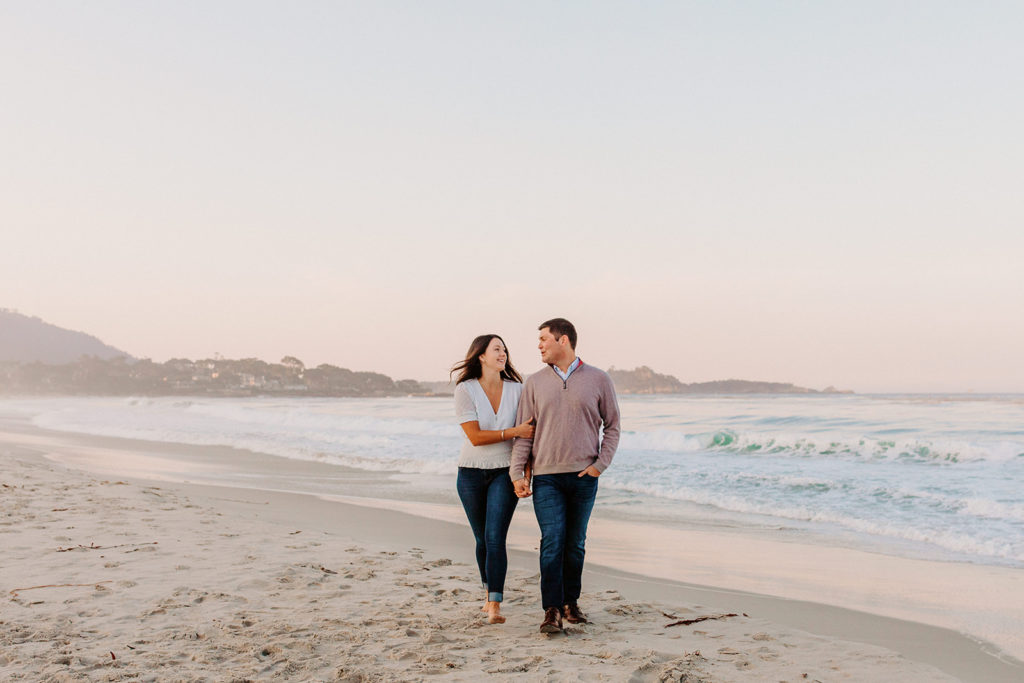 couple walking on beach, Carmel CA Engagement Photos, Monterey Engagement Photos, Monterey Engagement Photo Locations, Engagement Photo Outfits, California Beach Engagement Photos, Best Locations for Monterey Engagement Photos, What to Wear for Engagement Photos, Rachel Christopherson Photography LLC