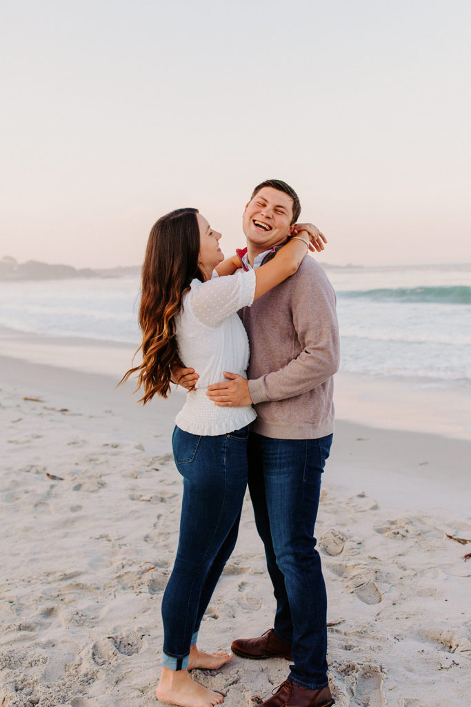 couple laughing on beach, Carmel CA Engagement Photos, Monterey Engagement Photos, Monterey Engagement Photo Locations, Engagement Photo Outfits, California Beach Engagement Photos, Best Locations for Monterey Engagement Photos, What to Wear for Engagement Photos, Rachel Christopherson Photography LLC