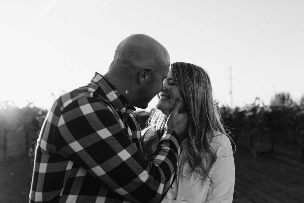 black and white photo of couple in golden vineyard during sunset, vineyard engagement photos, Sacramento engagement photos, sacramento engagement, sacramento engagement photographer sacramento engagement photo locations, sacramento wedding photographer, rachel christopherson photography, engagement photo outfit inspo