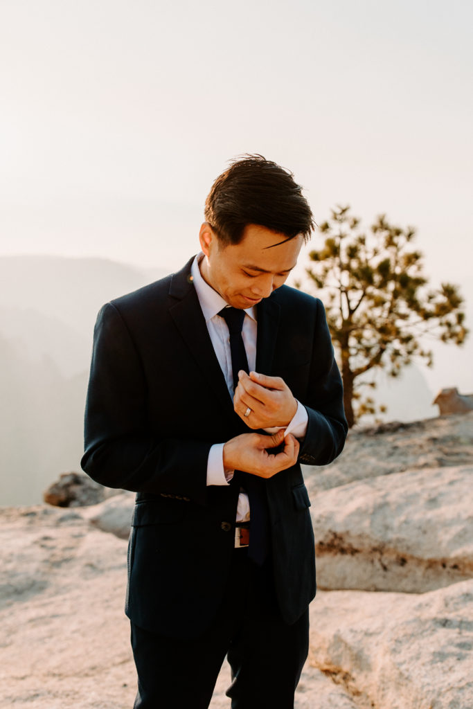 groom buttoning sleeve, Taft Point elopement, Yosemite Elopement, Glacier Point Elopement, best places to elope in california, northern california elopement, Rachel Christopherson Photography