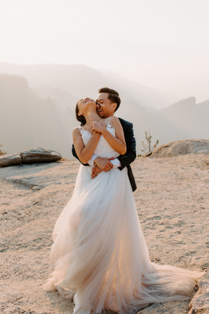 Groom lifting bride from behind, Taft Point elopement, Yosemite Elopement, Glacier Point Elopement, best places to elope in california, northern california elopement, Rachel Christopherson Photography