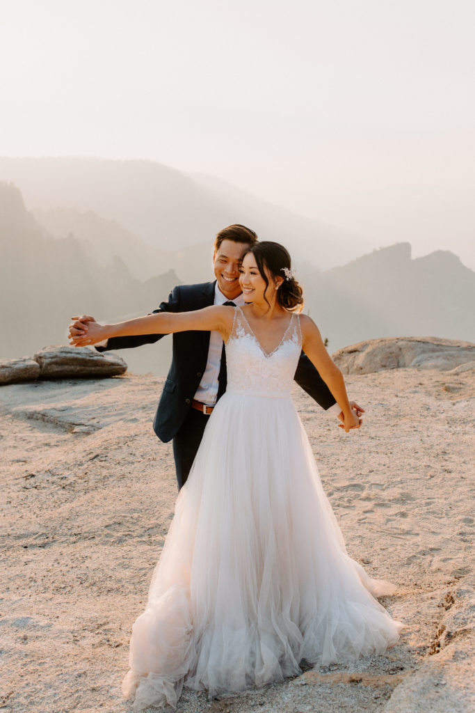 Groom behind bride airplane arms, Taft Point elopement, Yosemite Elopement, Glacier Point Elopement, best places to elope in california, northern california elopement, Rachel Christopherson Photography