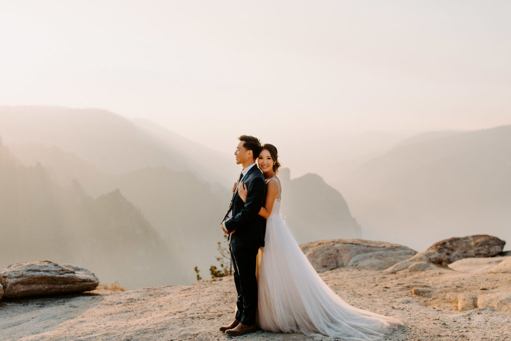 bride hugging groom from behind, Taft Point elopement, Yosemite Elopement, Glacier Point Elopement, best places to elope in california, northern california elopement, Rachel Christopherson Photography