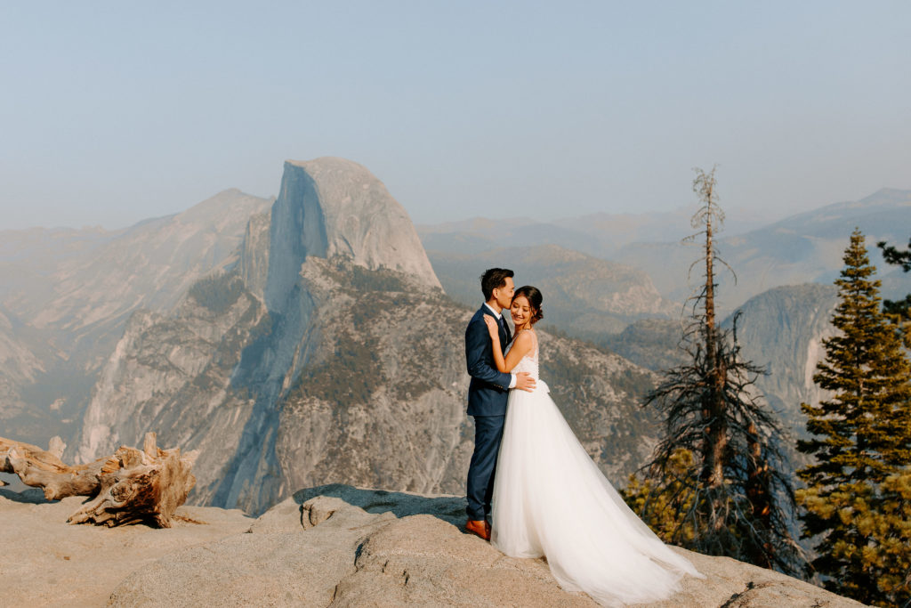 groom kissing bride at Glacier Point, Taft Point elopement, Yosemite Elopement, Glacier Point Elopement, best places to elope in california, northern california elopement, Rachel Christopherson Photography