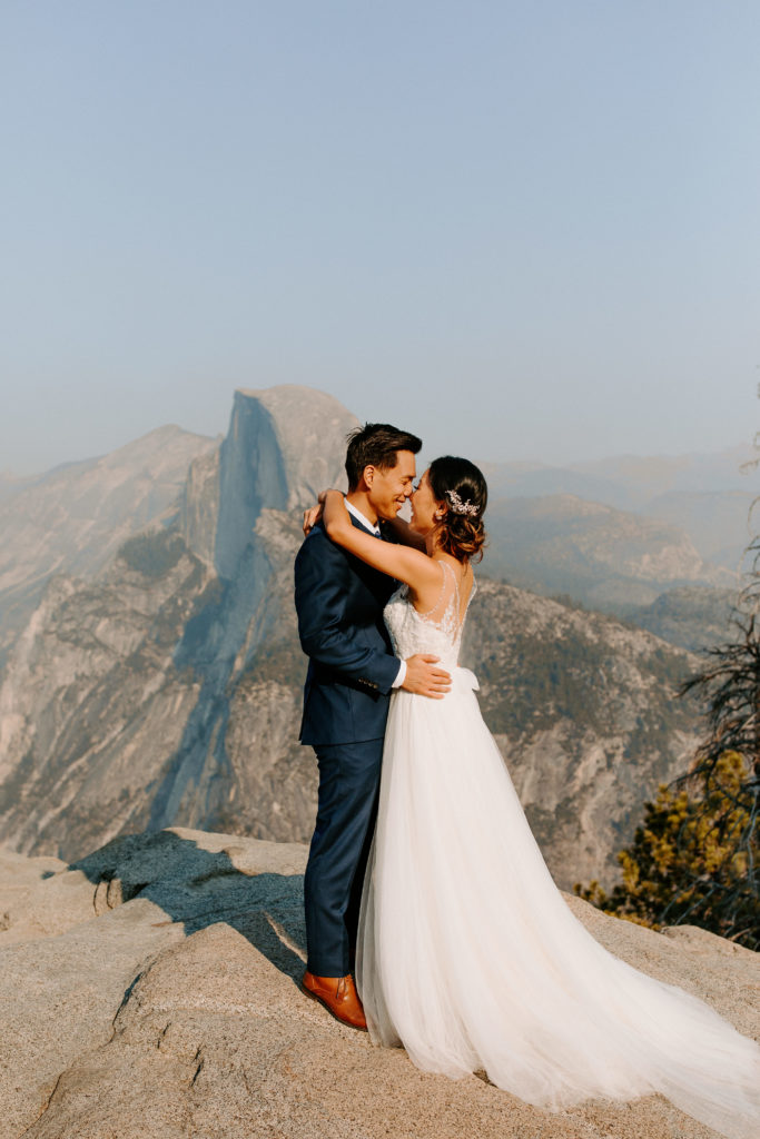 Bride and groom embracing at Glacier Point, Yosemite Elopement, Glacier Point Elopement, best places to elope in california, northern california elopement, Rachel Christopherson Photography