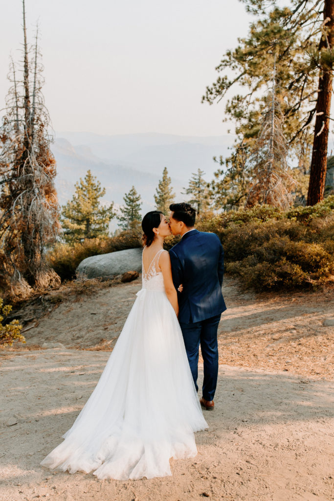 back of bride and groom at Glacier Point, Yosemite Elopement, Glacier Point Elopement, best places to elope in california, northern california elopement, Rachel Christopherson Photography